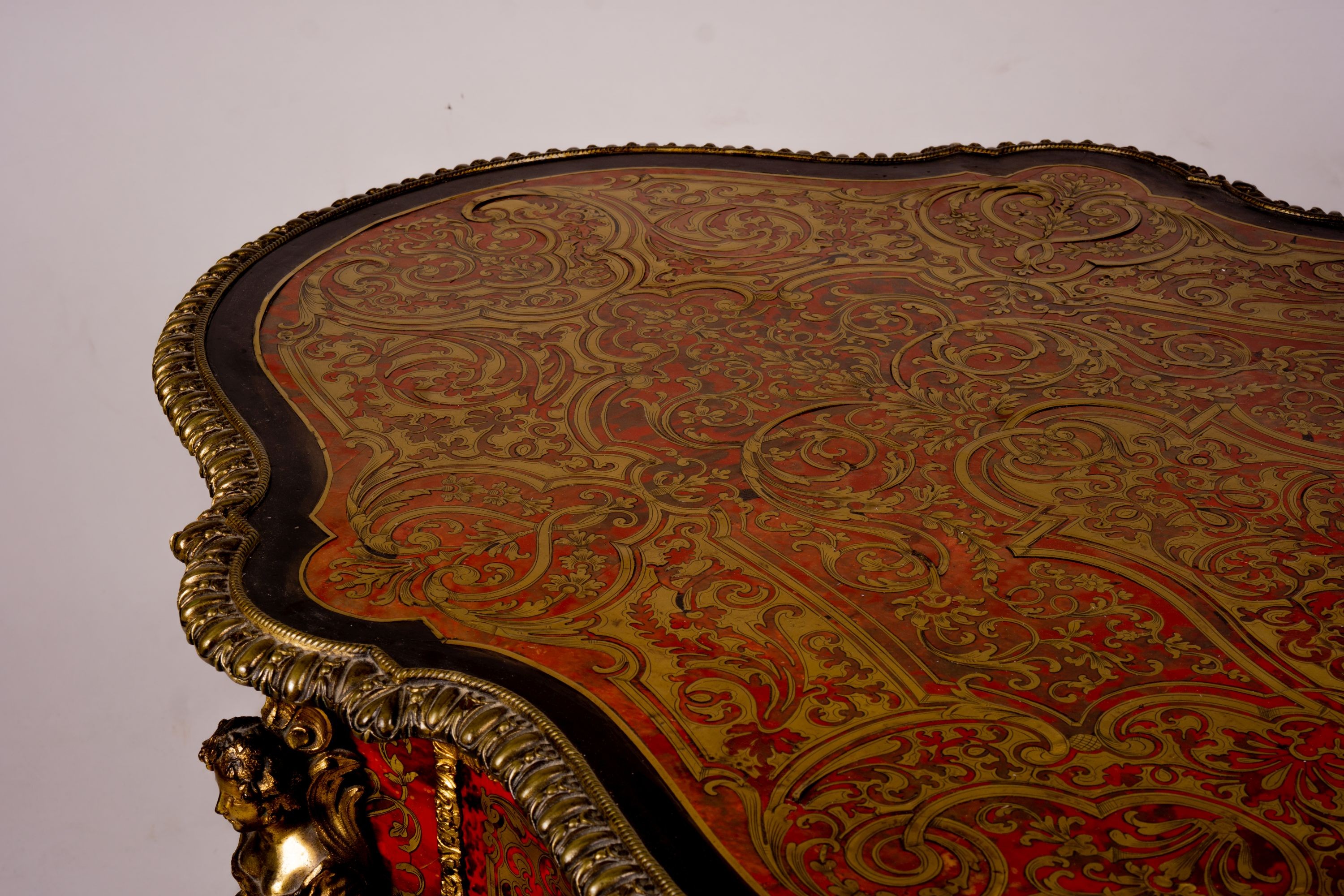 A 19th century Boulle inlaid centre table with shaped oval top, width 130cm, depth 78cm, height 76cm